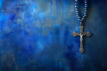 Silver Cross and Beads on Blue Background