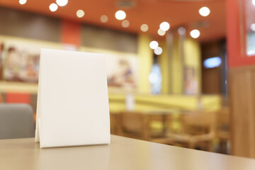 Menu mock up blank for text marketing promotion. Mock up Menu frame standing on wood table in restaurant space for text