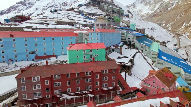 Aerial view establishing the residential building blocks of Sewell, mining camp of the El Teniente Mine, world heritage site, city in the middle of the Andes, Chile.