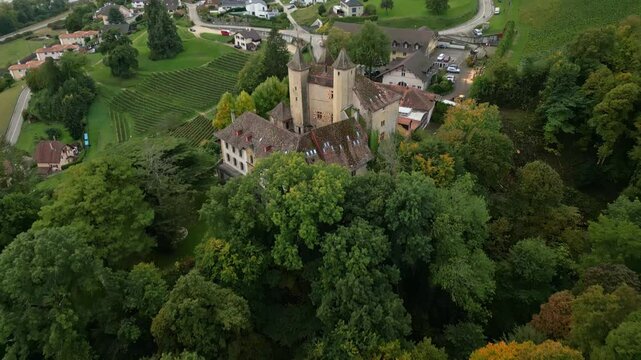 Reveal drone shot behind Vaumarcus Castle in Canton of Neuchatel Switzerland