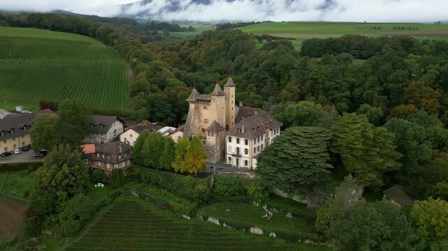 Crane down drone shot of Vaumarcus Castle in Canton of Neuchatel Switzerland