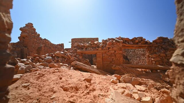 First-person walking on ruins of Chinguetti old holy city of Islam in desert of Mauritania, Africa.