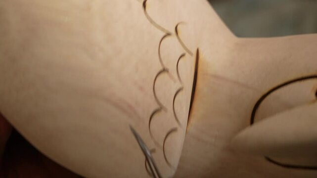 Engravings on balsa wood. Close-up