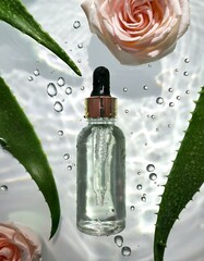 A sleek, frosted glass serum bottle suspended in mid-air, surrounded by tiny, sparkling water droplets and subtle reflections on a pure white background. Delicate sprigs of aloe and rose petals float 