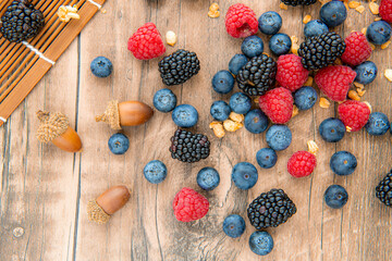 Close-up on assorted mix berries: blackberries, blueberries, raspberries, vertical image