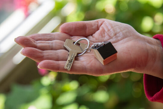 Mature woman showing new house keys
