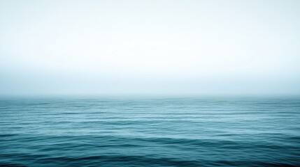 Fototapeta premium Calm Azure Ocean Under Soft Misty Sky