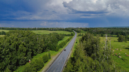 Trucks are driving on a beautiful road
