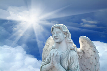The angel prays and glorifies God. Love, faith, religion, God, death, afterlife, safety concept.