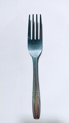 A stainless steel fork with four prongs and simple, elegant design