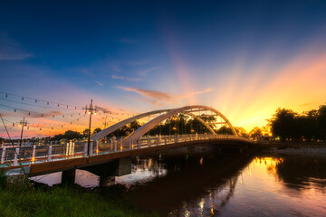 light Bridge over the Nan River (Wat Phra Si Rattana Mahathat also - Chan Palace) New Landmark It is a major tourist is Public places attraction Phitsanulok,Thailand.vivid Twilight dramatic sunset.