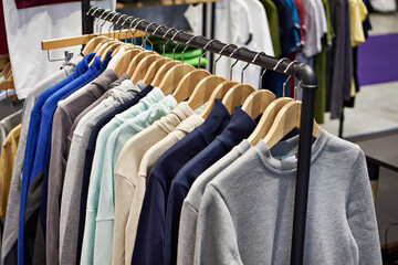 Sweaters on a hanger in a store