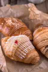 Croissants with different fillings on kraft paper