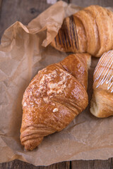 Croissants with different fillings on kraft paper