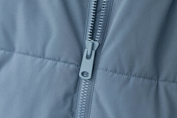 Close-up photo of a zipper on a jacket © Dmitri Krasovski