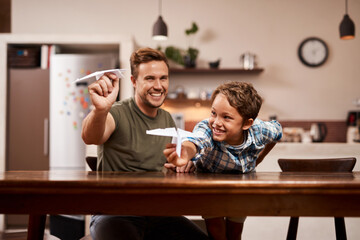 Dad, boy and happy for paper plane, playing and bonding together with fun, development and...