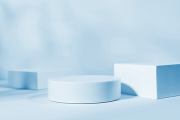 Blue background for product presentation with shadows and light. Empty round podium. Mockup