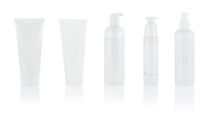 White cosmetic tubes and bottles isolate on white, serum, cream, micellar water. With dispenser. Set or collection