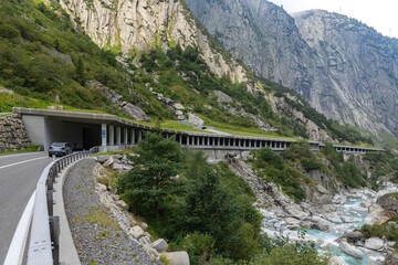 Swiss landscape with the Reuss River, road up the Gotthard Pass