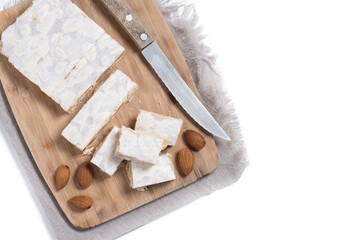 Christmas almond nougat isolated on white background. Top view. Copy space