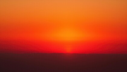 Obraz premium Serene Golden Sunset Over Horizon with Radiant Orange Gradient Sky and Soft Black Silhouette. Perfect Background for Inspirational Posters, Meditation Themes, or Travel Campaigns with Copy Space