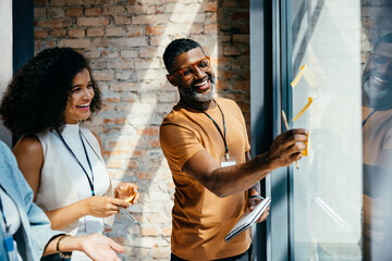 Corporate team collaborating enthusiastically during a creative business meeting