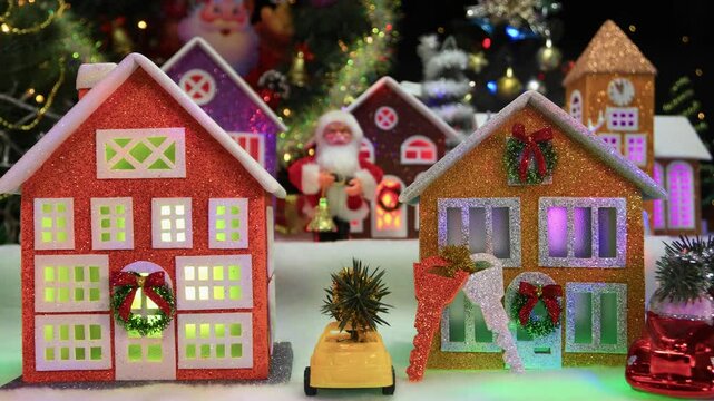 Christmas on the move a large Christmas town with a chapel and large decorated houses and cars near them