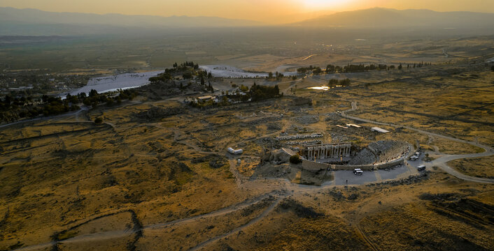 Aerial view of hierapolis ancient theater ruins at sunset surrounded by breathtaking landscape, Pamukkale, Turkey. - Powered by Adobe
