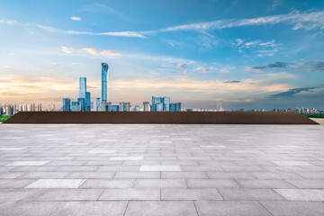 Empty floor square and cityscape with skyline in modern city at sunset