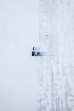 Aerial view of serene salt farm landscape with geometric patterns in white and snow, Dazkiri, Afyonkarahisar, Turkey.