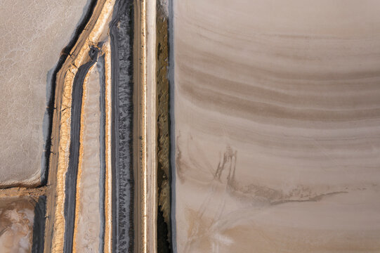 Aerial view of a unique salt farm with abstract patterns and dry landscape, Dazkiri, Turkey.