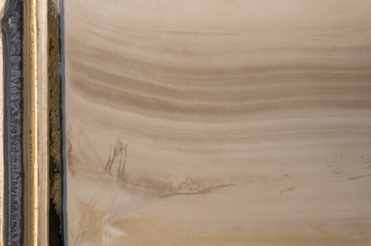 Fototapeta Aerial view of serene salt farm with abstract patterns and earthy tones, Dazkiri, Turkey.