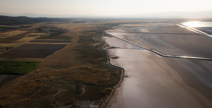 Aerial view of beautiful salt farm fields with tranquil water and expansive landscape, Dazkiri, Turkey.