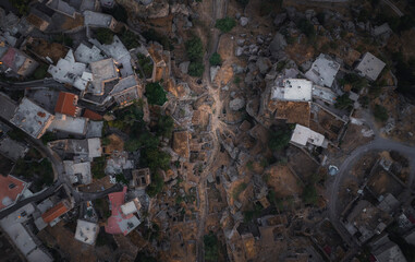 Aerial view of charming fairy chimneys and picturesque houses in a historic village, Guzelyurt, Turkey.