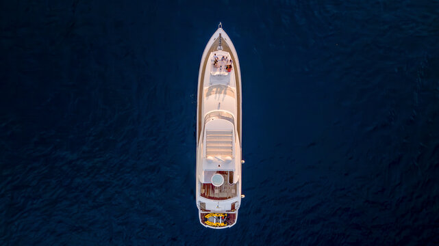 Aerial view of a luxurious yacht sailing on the serene blue ocean, Baja California Sur, Mexico.