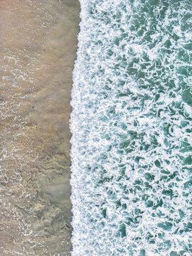Aerial view of beautiful tropical sea with waves and serene shore, Punta Mita, Mexico.