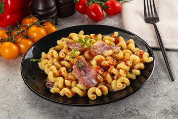 Italian pasta cellentani with anchovy