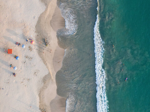Aerial view of La Ropa Beach with beautiful sandy shoreline and vibrant umbrellas, Zihuatanejo, Mexico.