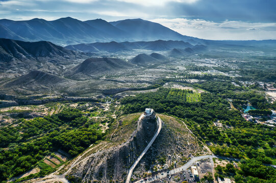 Aerial view of the serene Santo Madero mountain overlooking a picturesque valley and expansive fields, Parras, Coahuila de Zaragoza, Mexico.