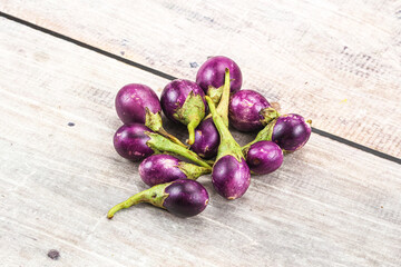 Small organic young purple round eggplant