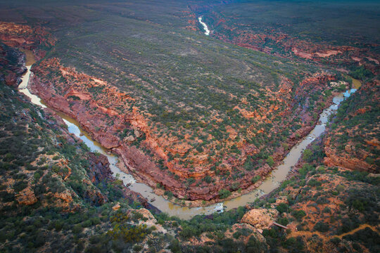 Aerial view of majestic Z Bend canyon with Murchison River winding through rugged landscape, Kalbarri National Park, Western Australia.