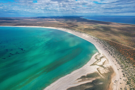 Aerial view of beautiful Shell Beach with sandy coastline and turquoise ocean, Shark Bay, Gascoyne Region, Australia.