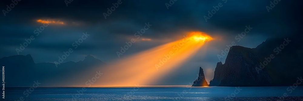 Poster Dramatic sun rays piercing through clouds creating a serene and ethereal atmosphere over a calm reflective ocean panorama