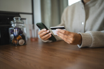Adult woman use smart phone for online shopping transaction safely
