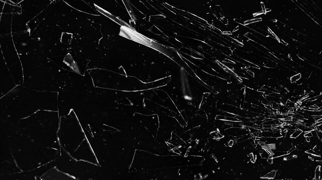 Super Slow Motion of Shattered Glass Isolated on Black Background. Glass Broken into Pieces. Filmed on High Speed Cinema Camera, 1000 fps.