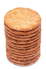 A Stack of Round Salt Crackers with Sesame Isolated on White Background. Dry Snacks - Isolation
