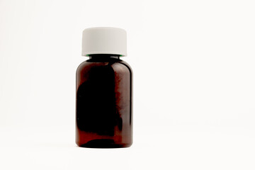 pharmaceutical brown pill tablet bottle isolated on a white background