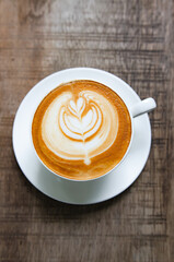 Latte Coffee on a Wooden Table A Warm Morning Moment