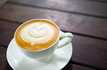 Latte Coffee on a Wooden Table A Warm Morning Moment