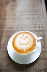 Latte Coffee on a Wooden Table A Warm Morning Moment